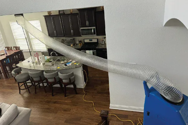 Air duct cleaning using a negative air machine.